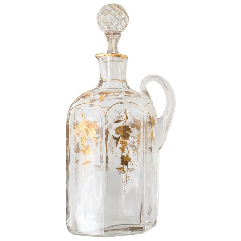 ANTIQUE GLASS AND GOLD DECANTER WITH GRAPES