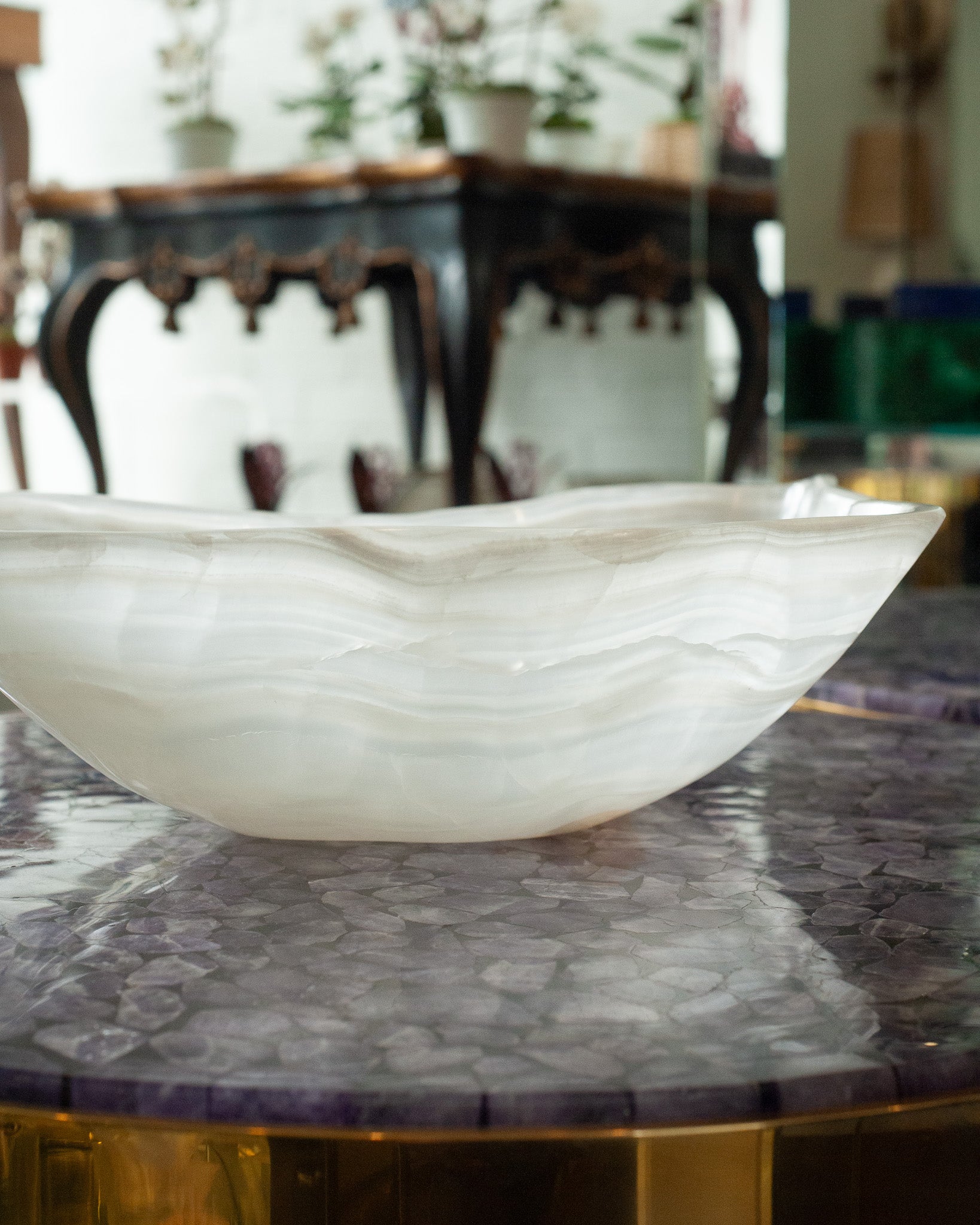 CONTEMPORARY FREEFORM HAND CARVED BANDED ONYX BOWL