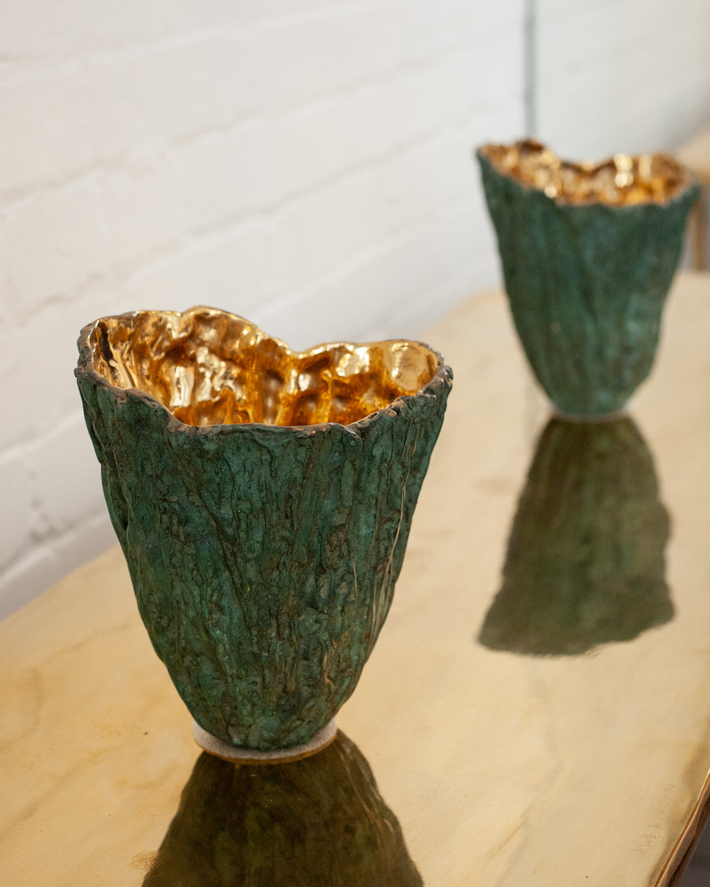 CONTEMPORARY GREEN PATINATED BRASS WOOD BARK VASE WITH POLISHED BRASS INTERIOR