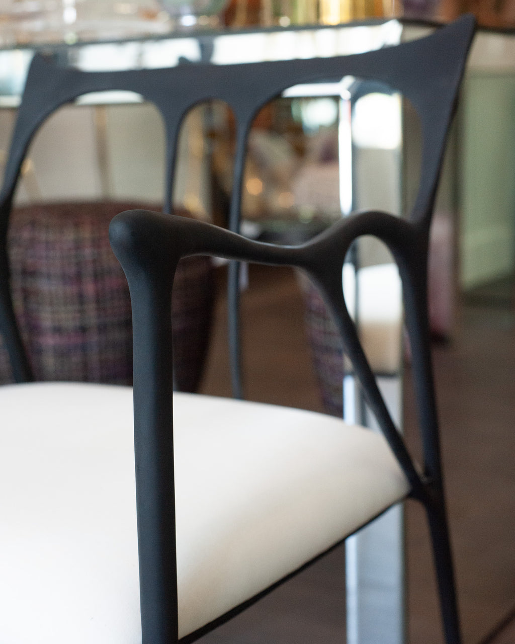 CONTEMPORARY BLACKENED CAST BRASS SCULPTURAL ARMCHAIR WITH CALICO SEAT