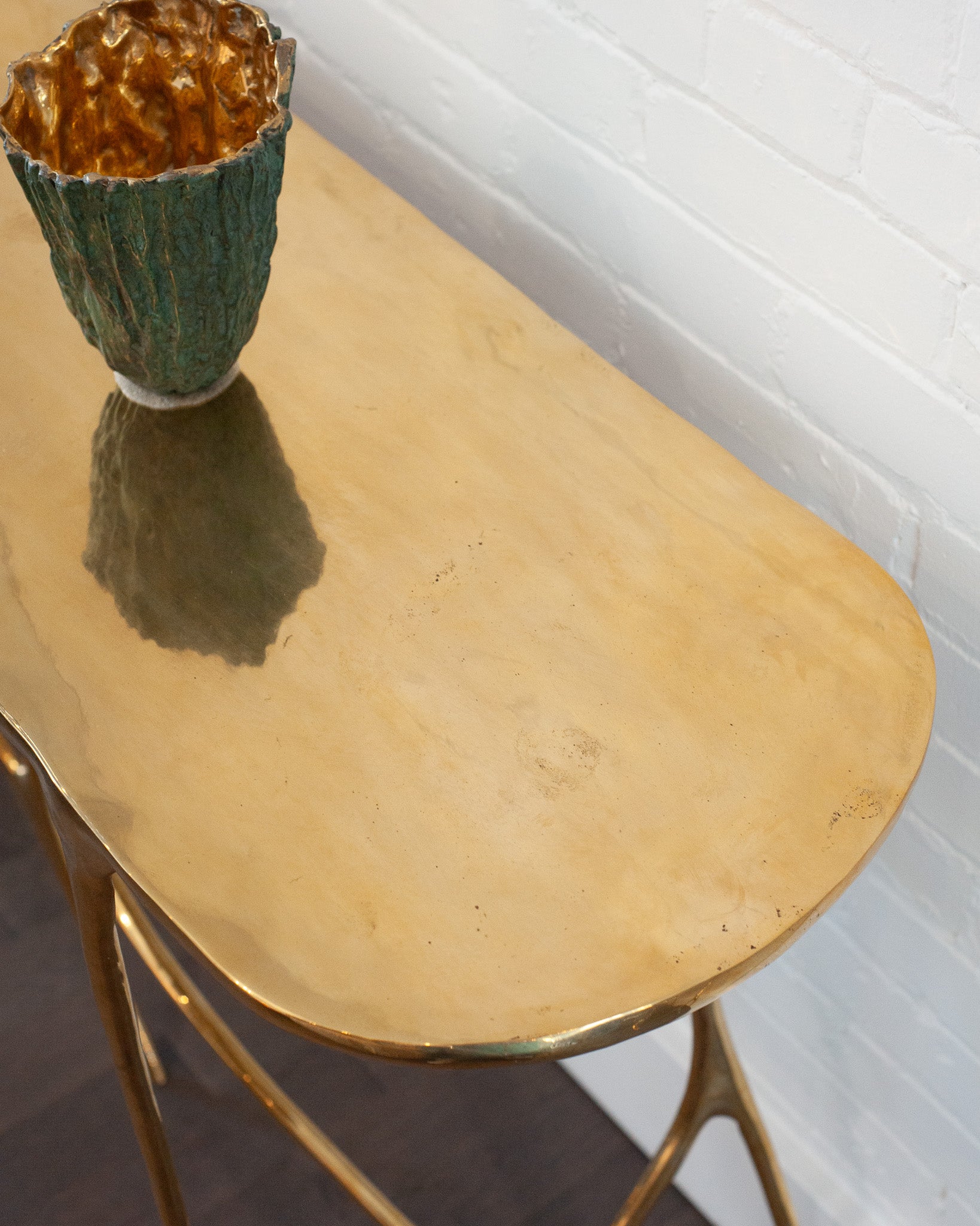 CONTEMPORARY POLISHED CAST BRASS SCULPTURAL CONSOLE TABLE