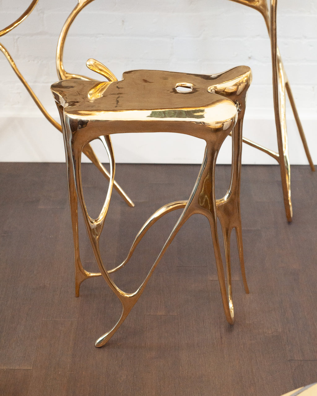 CONTEMPORARY POLISHED CAST BRASS SCULPTURAL SIDE TABLE