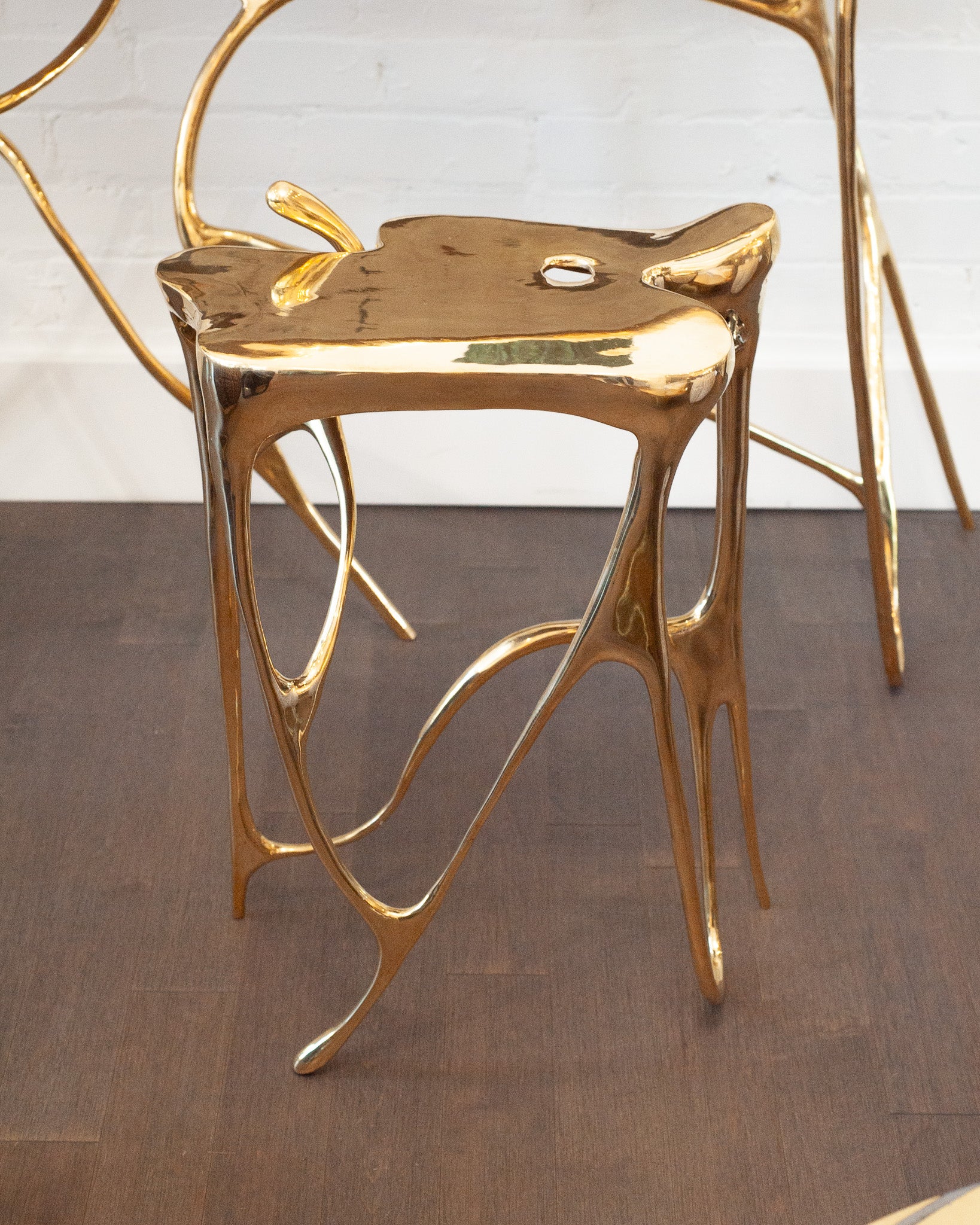 CONTEMPORARY POLISHED CAST BRASS SCULPTURAL SIDE TABLE