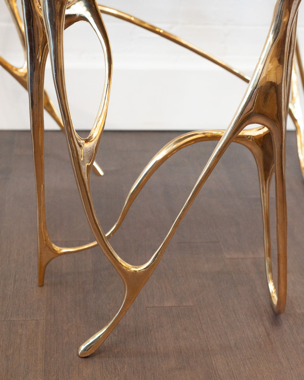 CONTEMPORARY POLISHED CAST BRASS SCULPTURAL SIDE TABLE