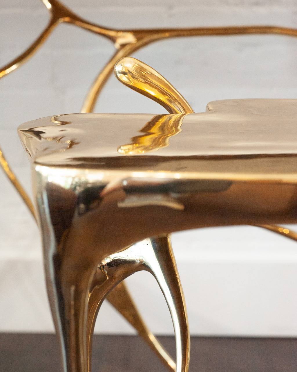 CONTEMPORARY POLISHED CAST BRASS SCULPTURAL SIDE TABLE