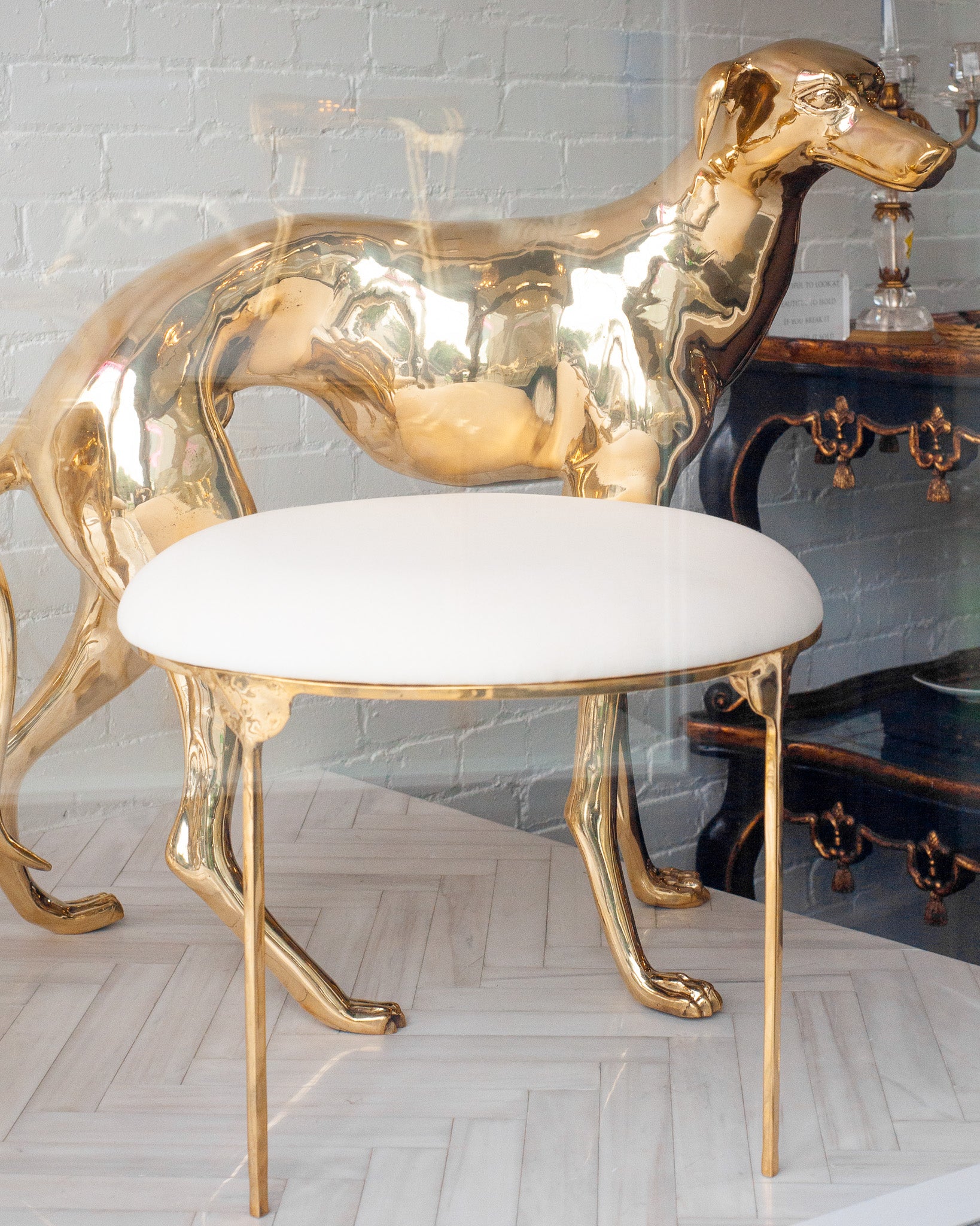 CONTEMPORARY PAIR OF POLISHED CAST BRASS GREYHOUND CHAIRS