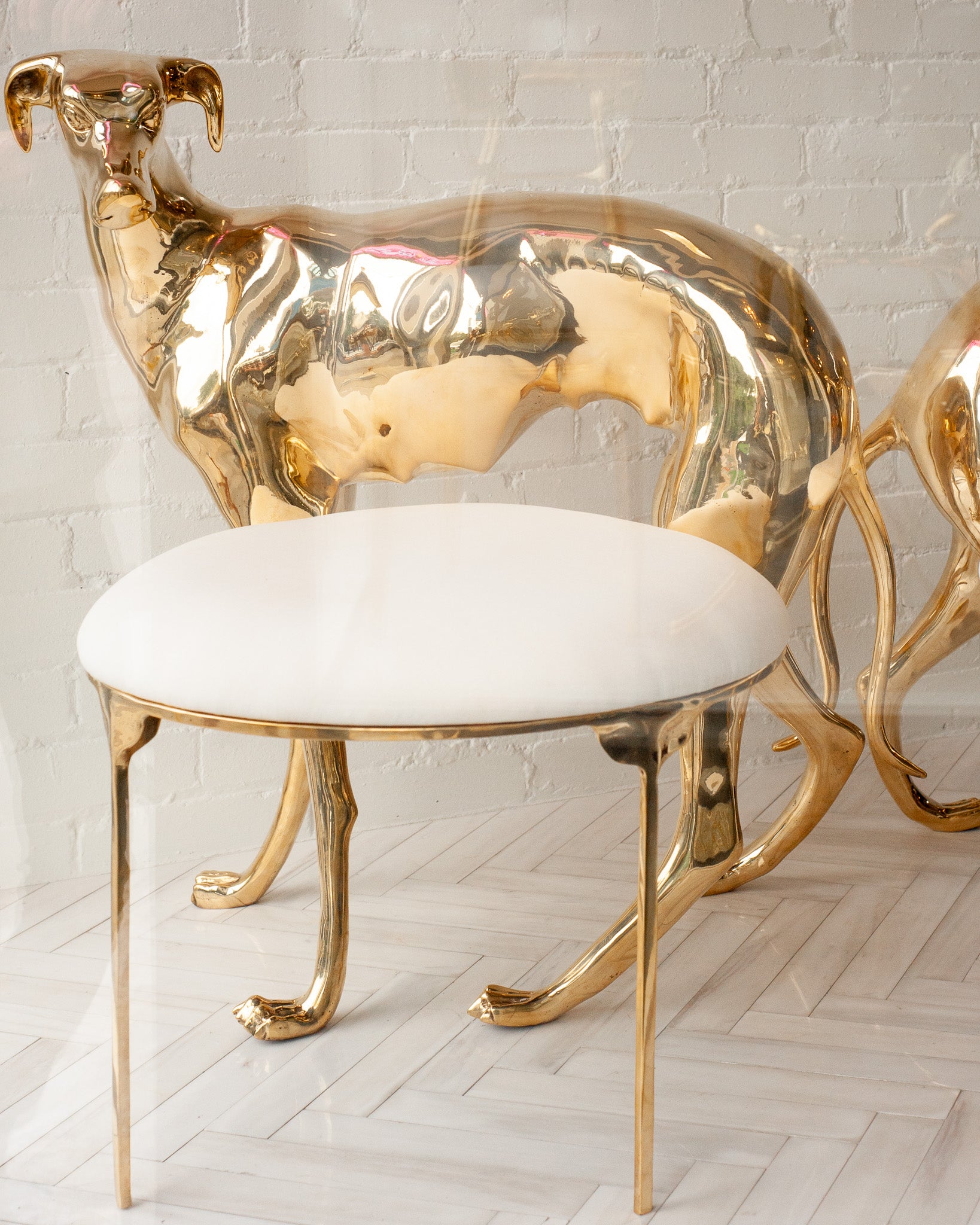 CONTEMPORARY PAIR OF POLISHED CAST BRASS GREYHOUND CHAIRS