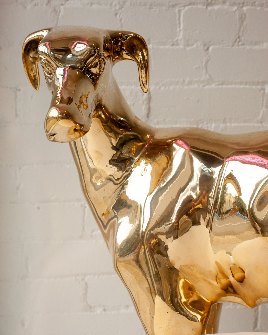 CONTEMPORARY PAIR OF POLISHED CAST BRASS GREYHOUND CHAIRS