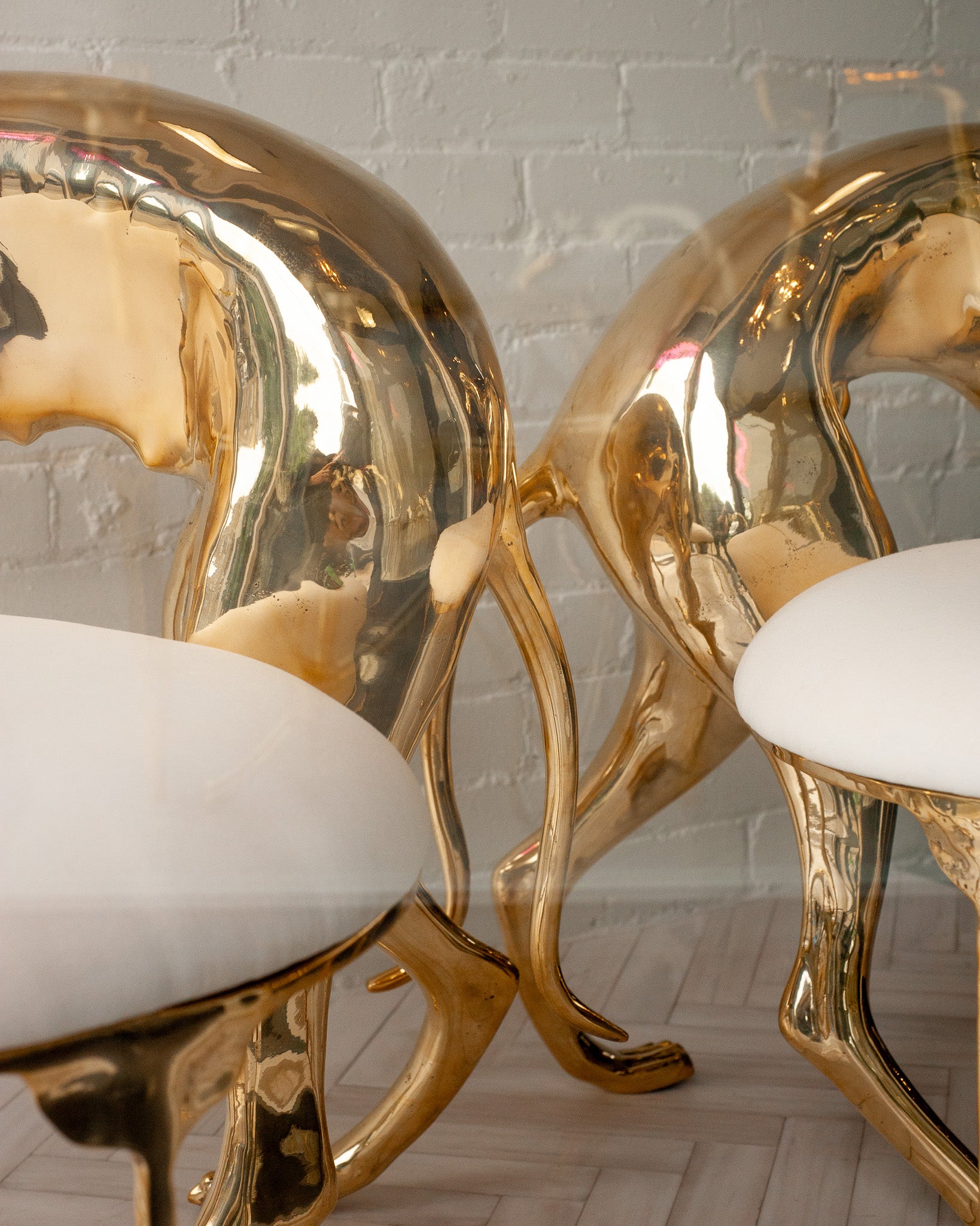 CONTEMPORARY PAIR OF POLISHED CAST BRASS GREYHOUND CHAIRS