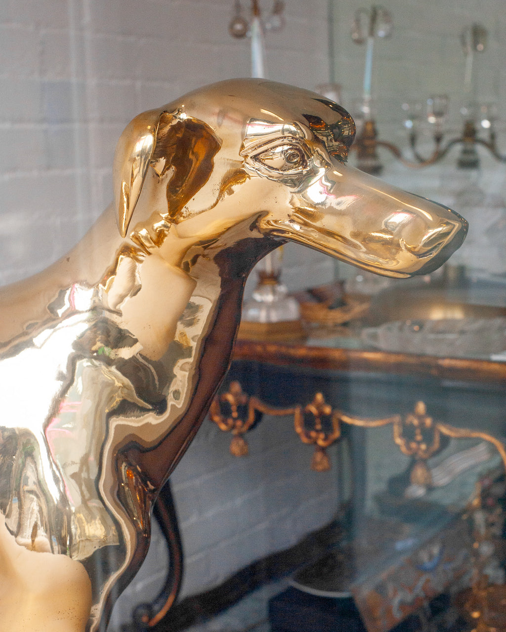 CONTEMPORARY PAIR OF POLISHED CAST BRASS GREYHOUND CHAIRS
