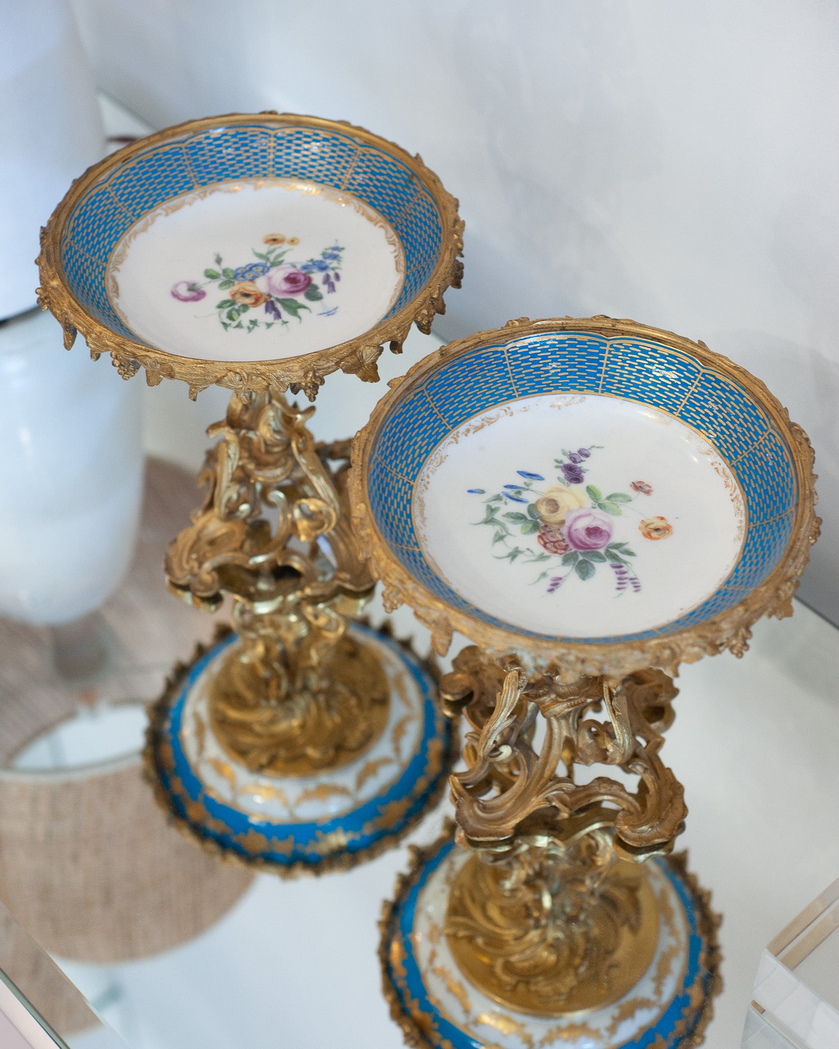 ANTIQUE SÉVRES STYLE PORCELAIN COMPOTES WITH GILT BRONZE FEET