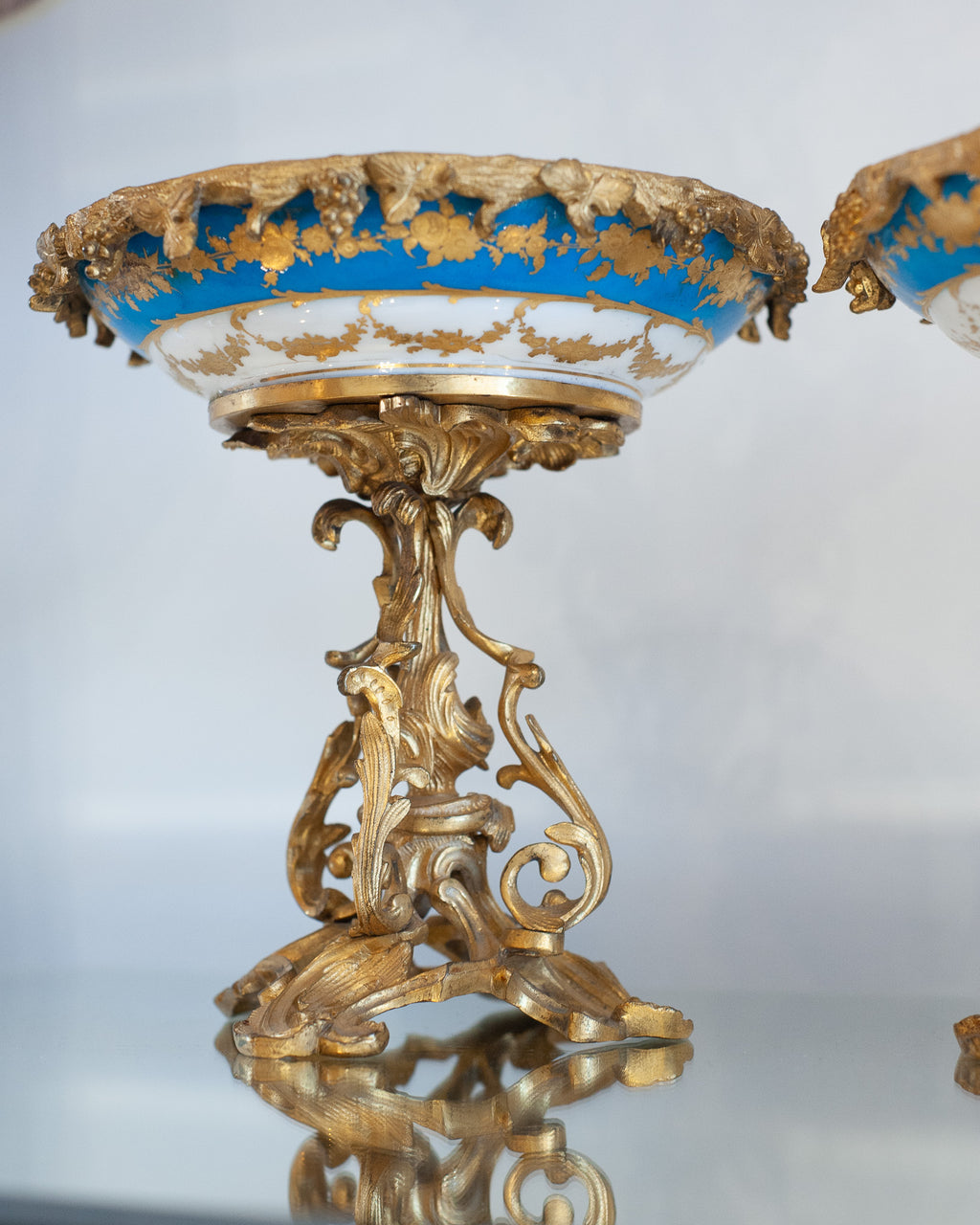 ANTIQUE SÉVRES STYLE PORCELAIN COMPOTES WITH GILT BRONZE FEET