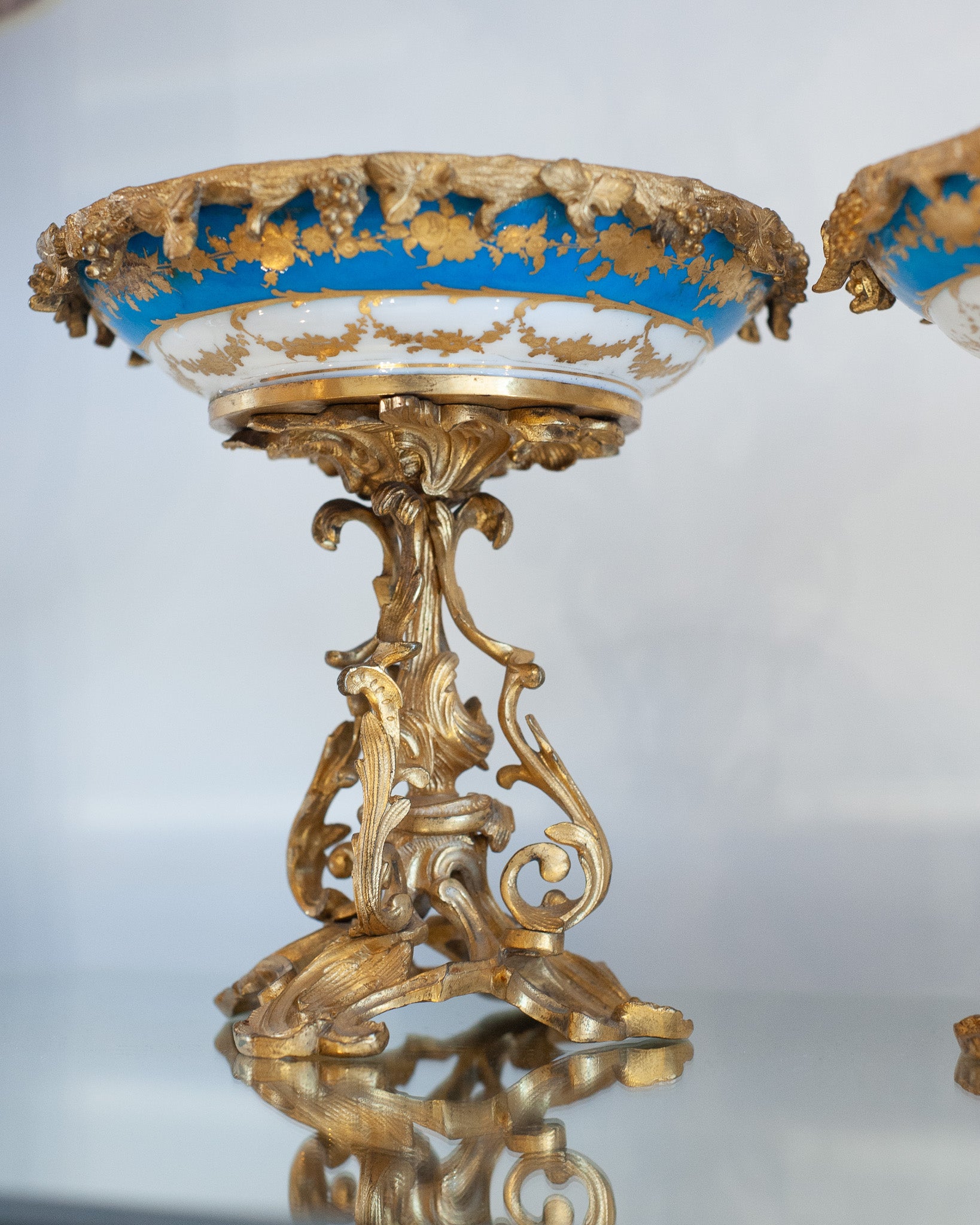 ANTIQUE SÉVRES STYLE PORCELAIN COMPOTES WITH GILT BRONZE FEET