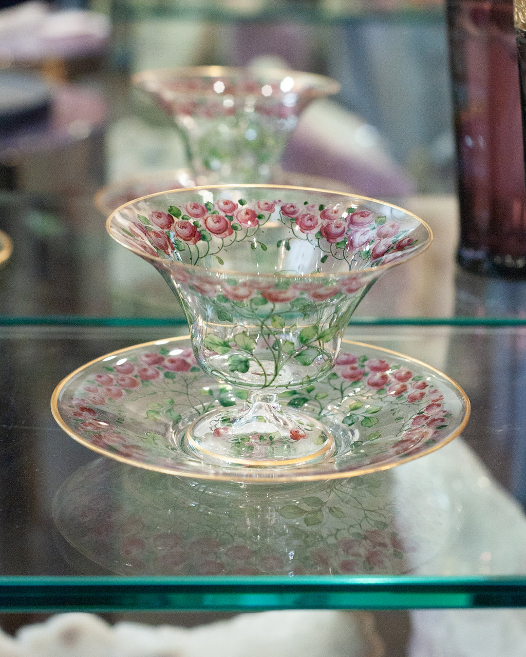 ANTIQUE BOHEMIAN FOOTED BOWL AND UNDERPLATE WITH GILDED RIMS AND ROSE FLORALS