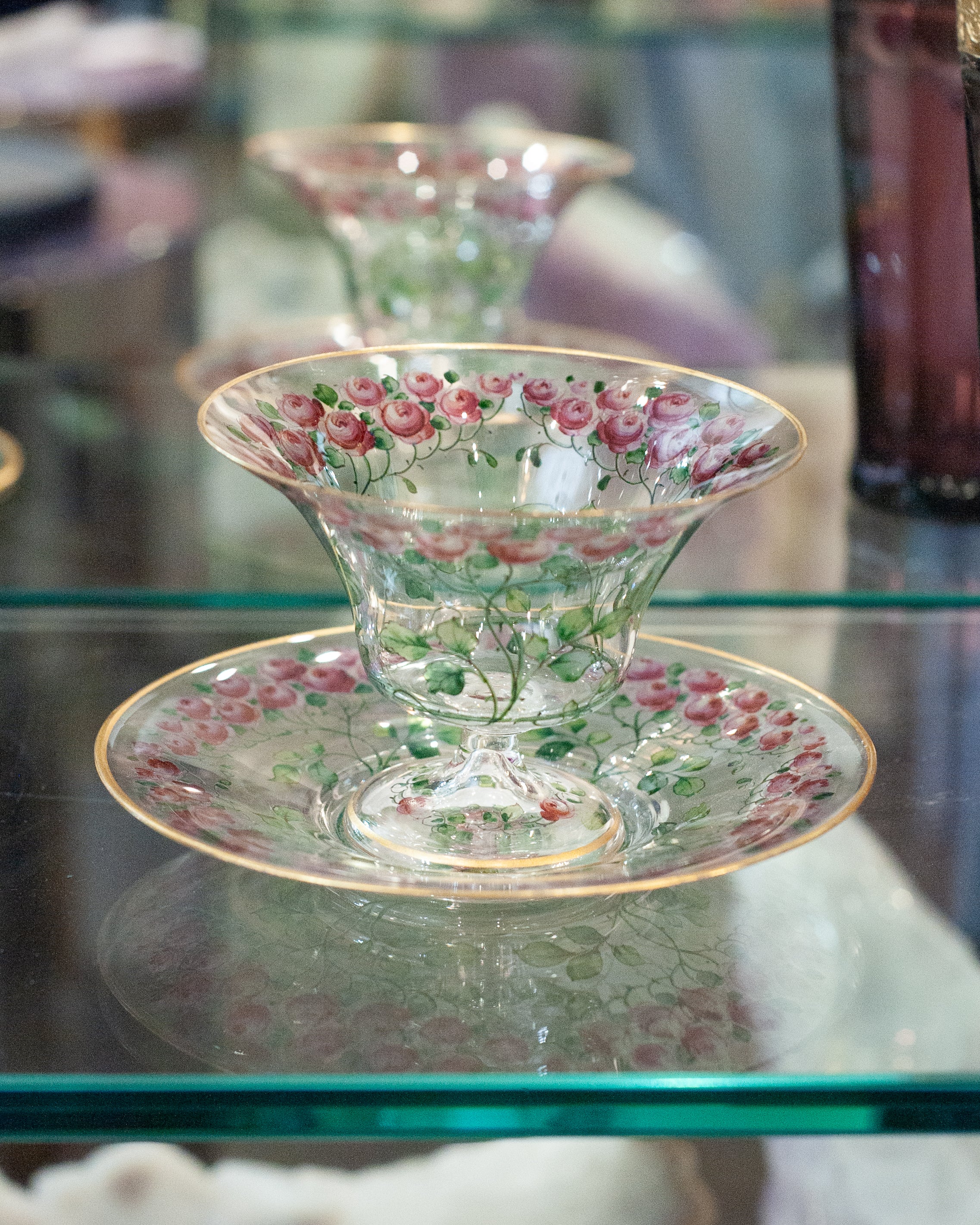 ANTIQUE BOHEMIAN FOOTED BOWL AND UNDERPLATE WITH GILDED RIMS AND ROSE FLORALS