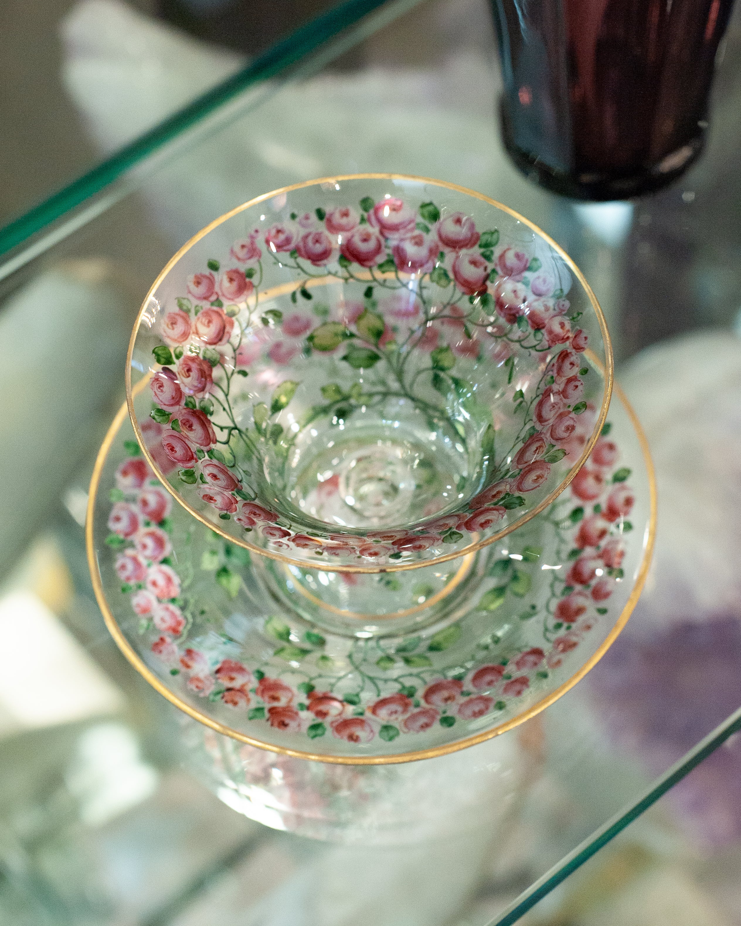 ANTIQUE BOHEMIAN FOOTED BOWL AND UNDERPLATE WITH GILDED RIMS AND ROSE FLORALS