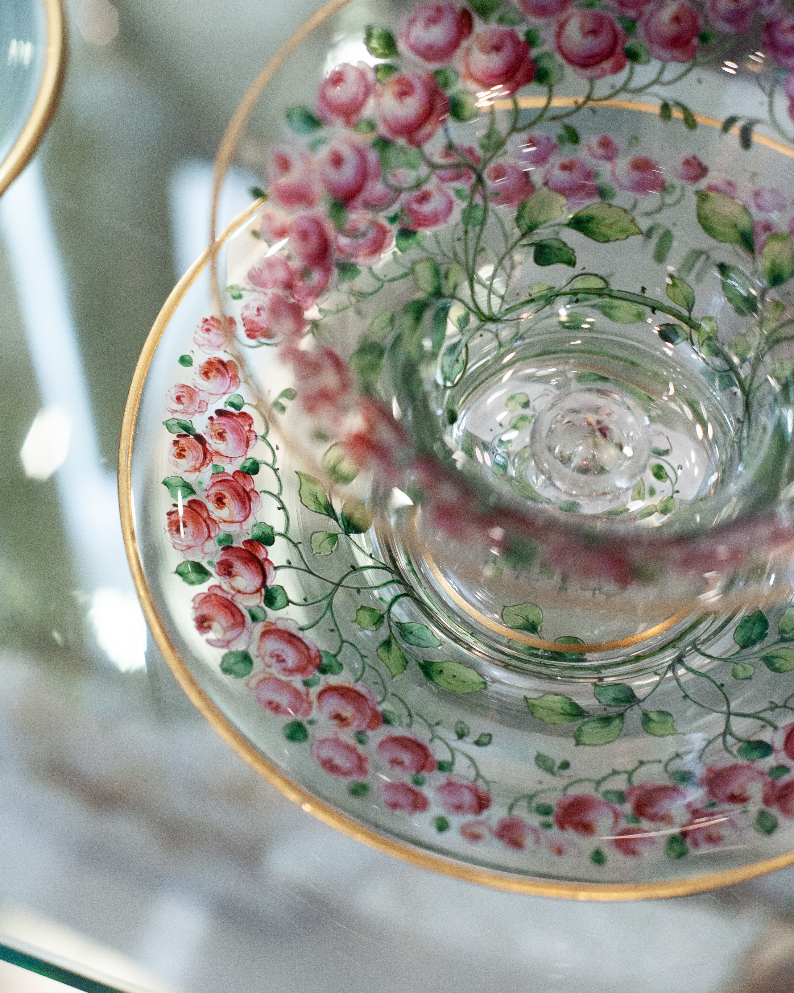 ANTIQUE BOHEMIAN FOOTED BOWL AND UNDERPLATE WITH GILDED RIMS AND ROSE FLORALS