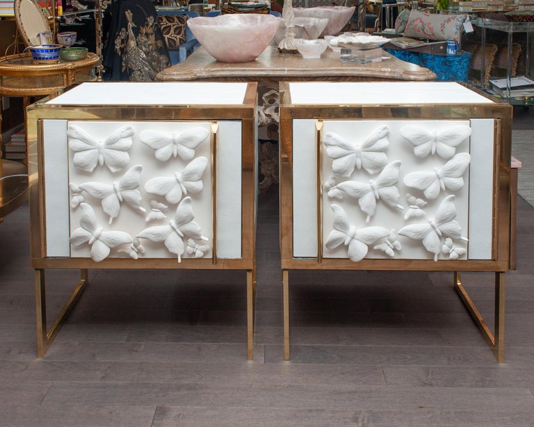 CONTEMPORARY PAIR OF GLASS AND BRASS NIGHTSTANDS WITH MID CENTURY BUTTERFLY PORCELAIN PANELS