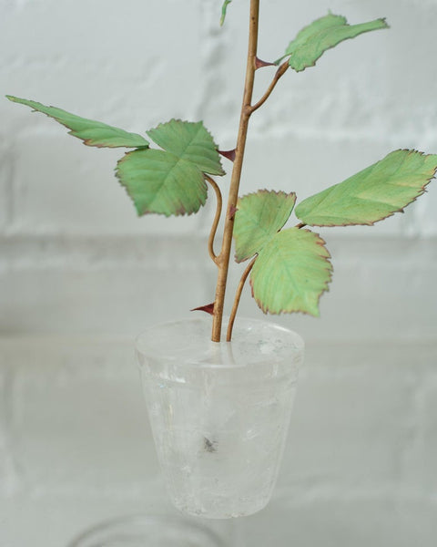 BISCUIT PORCELAIN ROSE IN ROCK CRYSTAL POT