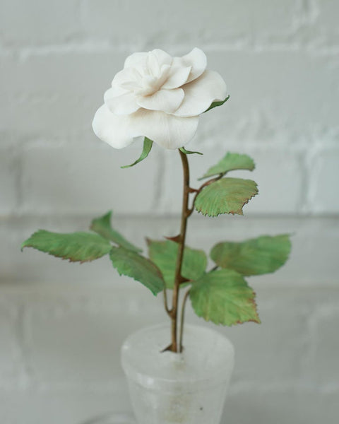 BISCUIT PORCELAIN ROSE IN ROCK CRYSTAL POT