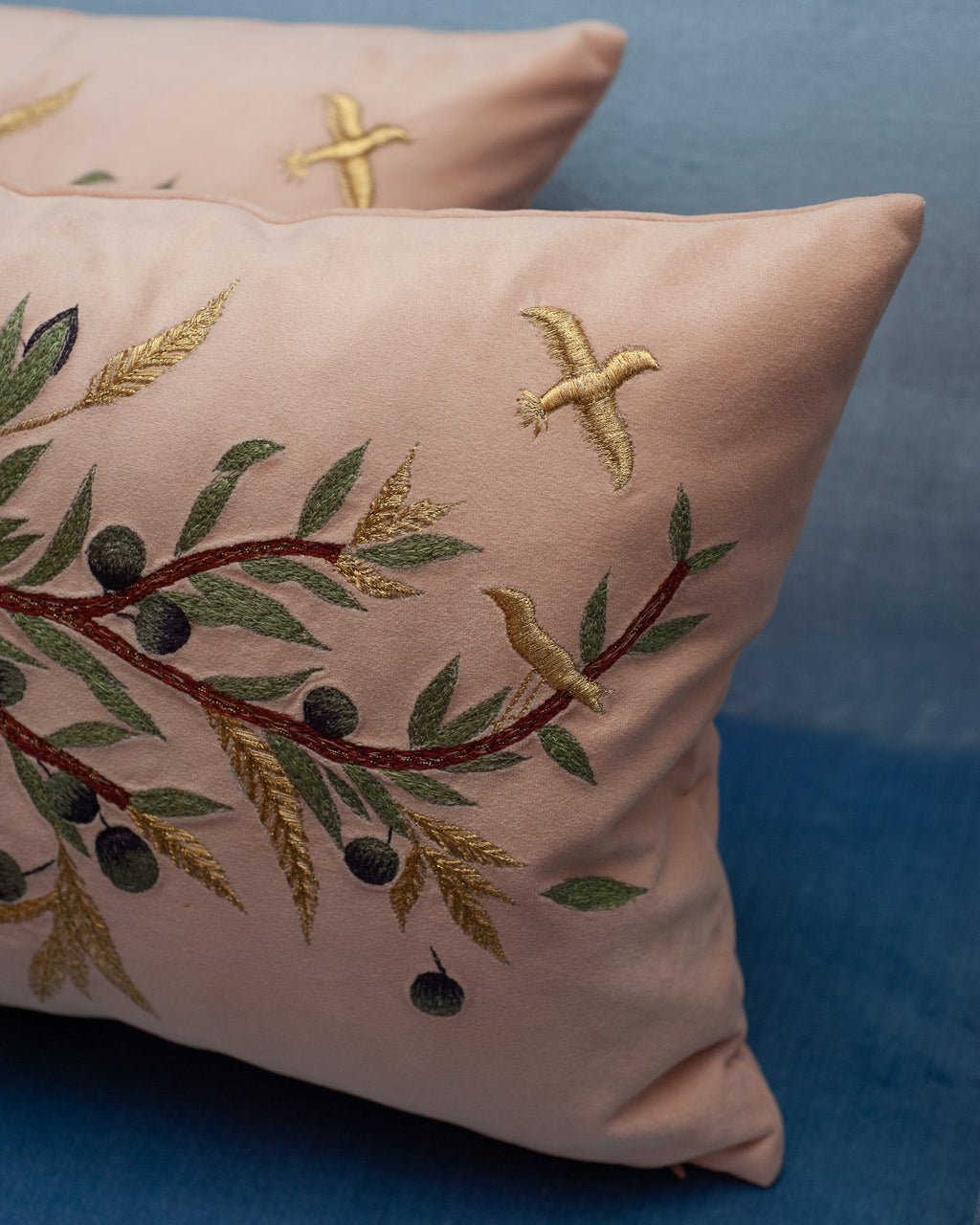CONTEMPORARY EMBROIDERED PILLOW ON SOFT PINK ULTRASUEDE WITH DOVE & OLIVE BRANCH