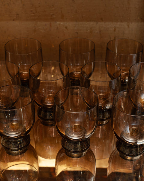 CONTEMPORARY SET OF 10 BELL SHAPED MURANO TUMBLERS IN SMOKE WITH GOLD LEAF BASE