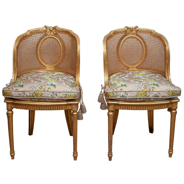 ANTIQUE PAIR OF FRENCH GILDED CHAIRS WITH CANE WEBBING AND UPHOLSTERED CUSHIONS