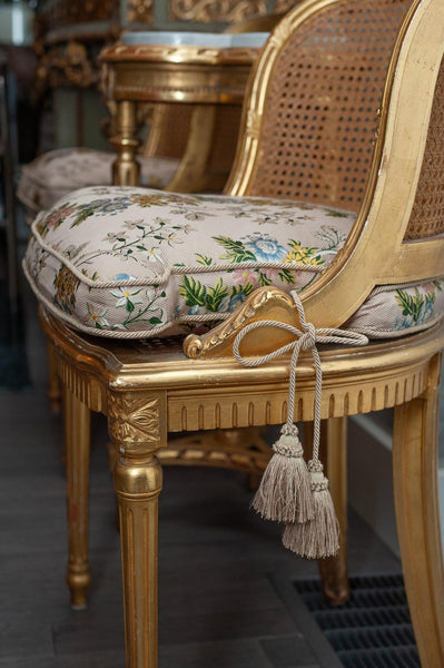 ANTIQUE PAIR OF FRENCH GILDED CHAIRS WITH CANE WEBBING AND UPHOLSTERED CUSHIONS