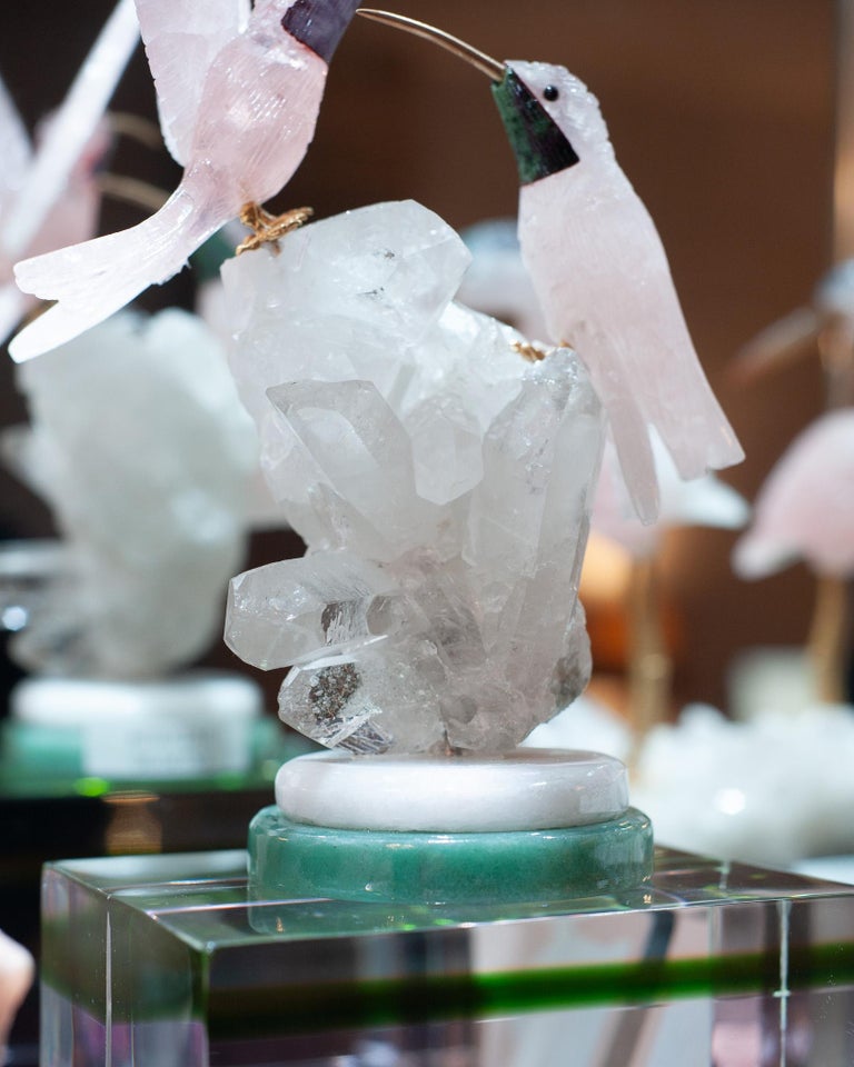 A PAIR OF ROSE QUARTZ HUMMINGBIRDS ON ROCK CRYSTAL AND MARBLE MINERAL BASE