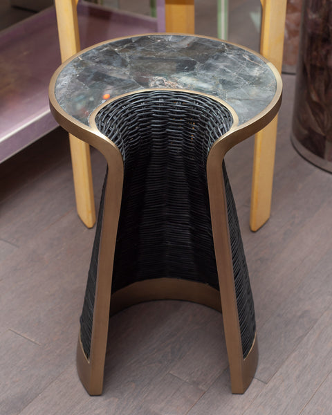 CONTEMPORARY R & Y AUGOUSTI RATTAN, BLACK QUARTZ, AND PATINATED BRASS SIDE TABLE