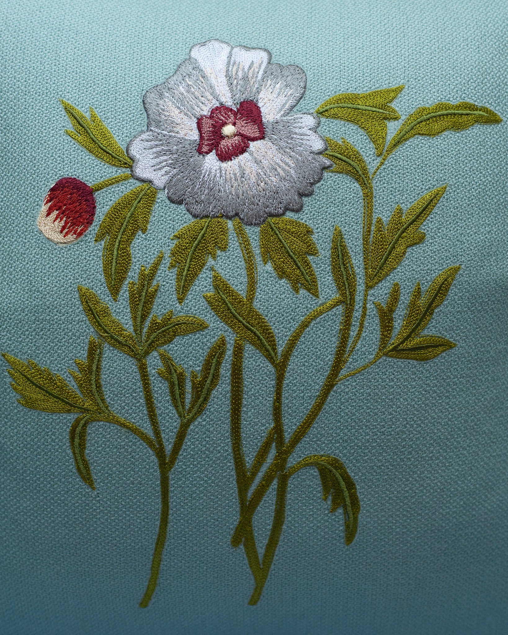CONTEMPORARY SOFT BLUE MERINO WOOL AND LINEN PILLOW WITH EMBROIDERED FLOWER