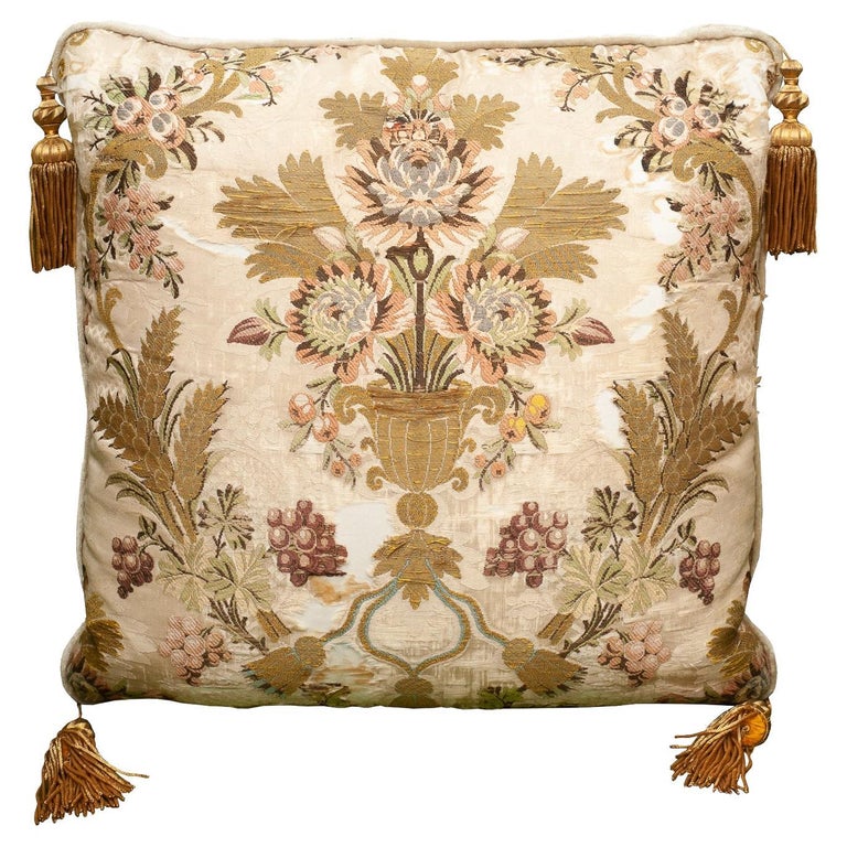 CREAM SILK PILLOW WITH ANTIQUE EMBROIDERED TEXTILE PANEL AND METALLIC TASSELS