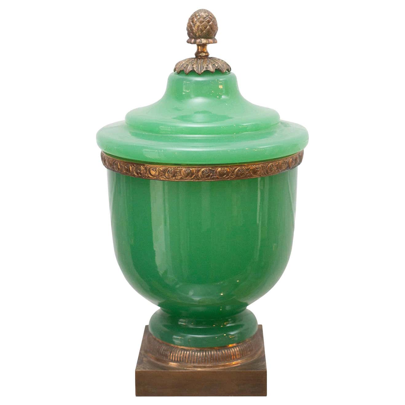 ANTIQUE GREEN OPALINE COVERED JAR WITH ACORN FINIAL