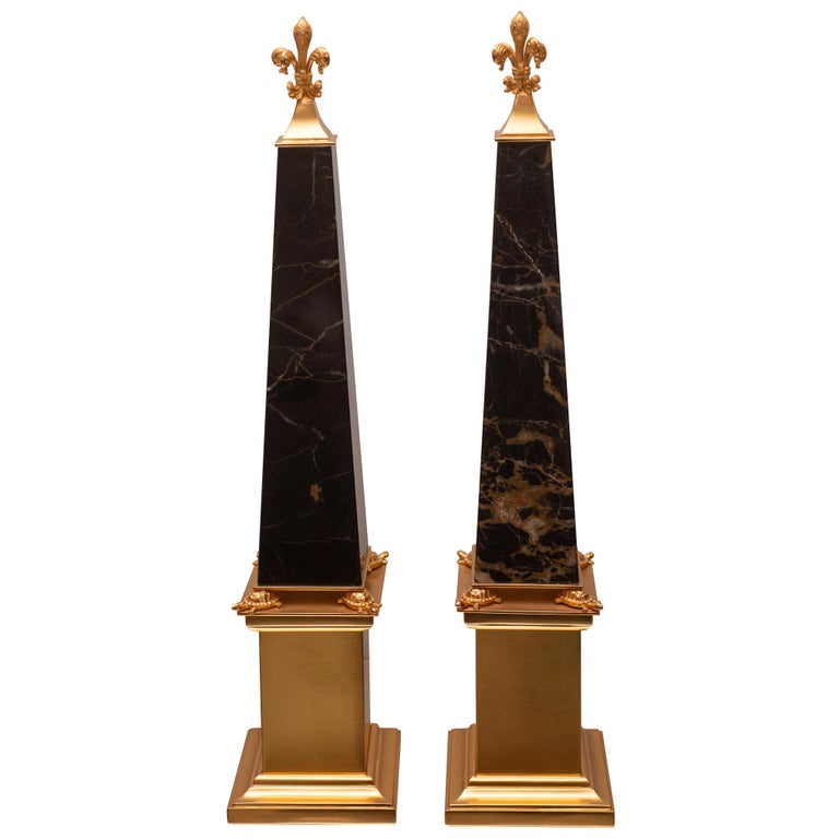 CONTEMPORARY PAIR OF BRONZE & ST. LAURENT OBELISKS