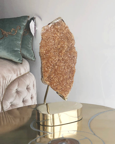 Our latest arrival in our Studio Maison Nurita line. This bold Citrine quartz stone is delicately held in place with a custom made brass setting and base. Citrine harnesses the warmth and comfort of the sun. Energize your home with this one of a kind decorative objet.