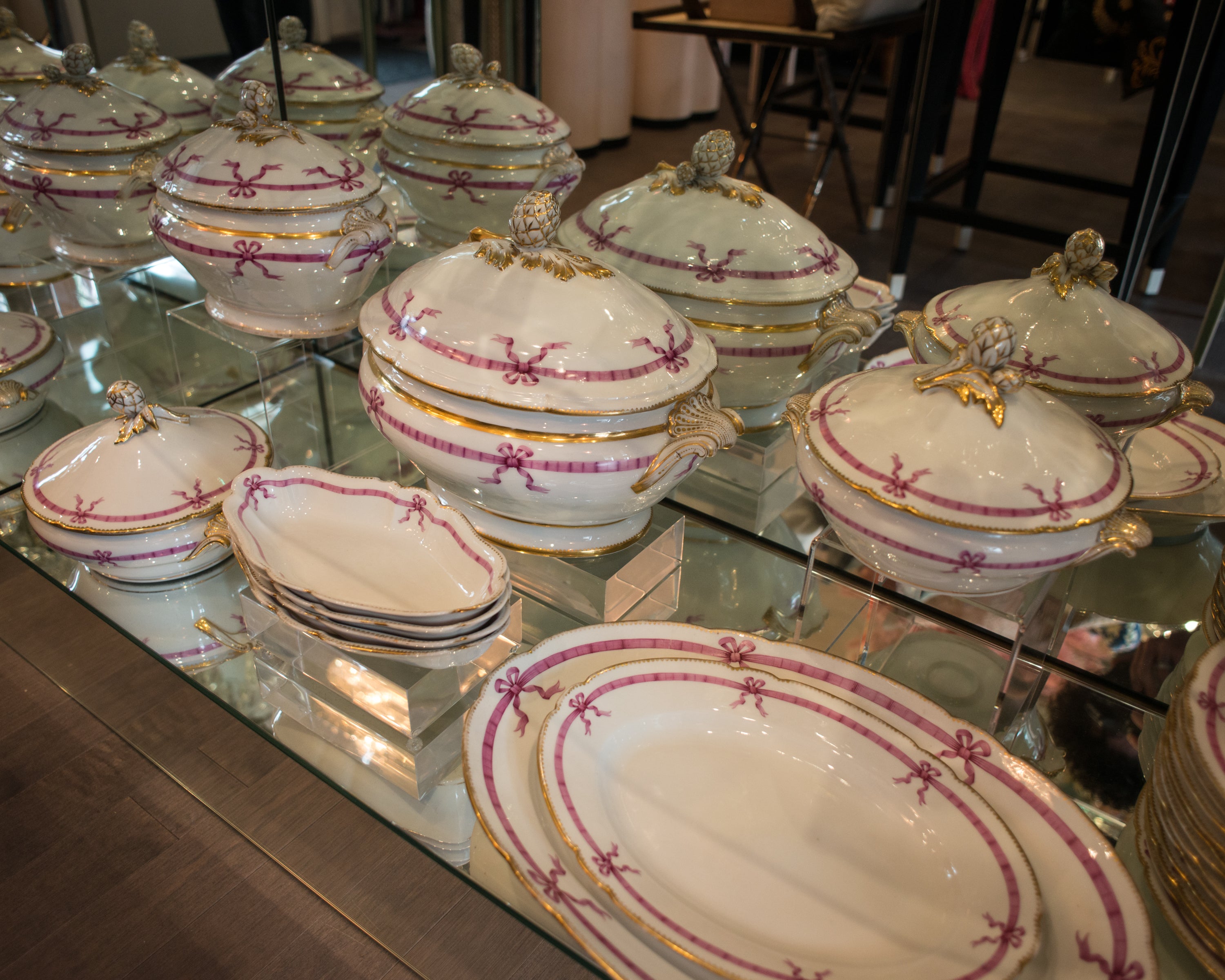 A Magnificent French Antique 22 piece dinner set circa 1850 with pink ribbon design.