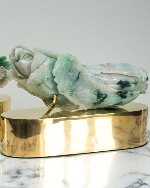 This charming, unusual Antique Chinese Carved Jade Cabbage is part of a pair and sold individually. Each rests on a custom Studio Maison Nurita brass base. Jade is a symbol of serenity and purity, signifying wisdom and tranquility. Jade cabbages are thought to be a symbol of wealth and fertility. The most popular Jade Cabbage is exhibited in the National Palace Museum in Taipei and is viewed as a national treasure.