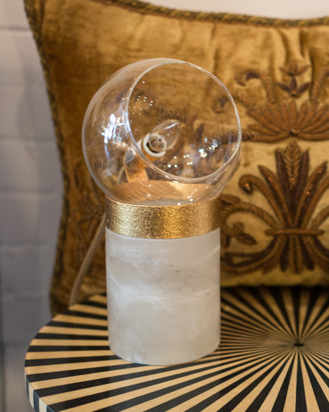 A pair of small lamps on solid quartz bases with glass domes and brass details. Suitable for a desk, night stands or end tables.