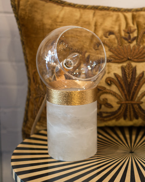 A pair of small lamps on solid quartz bases with glass domes and brass details. Suitable for a desk, night stands or end tables.