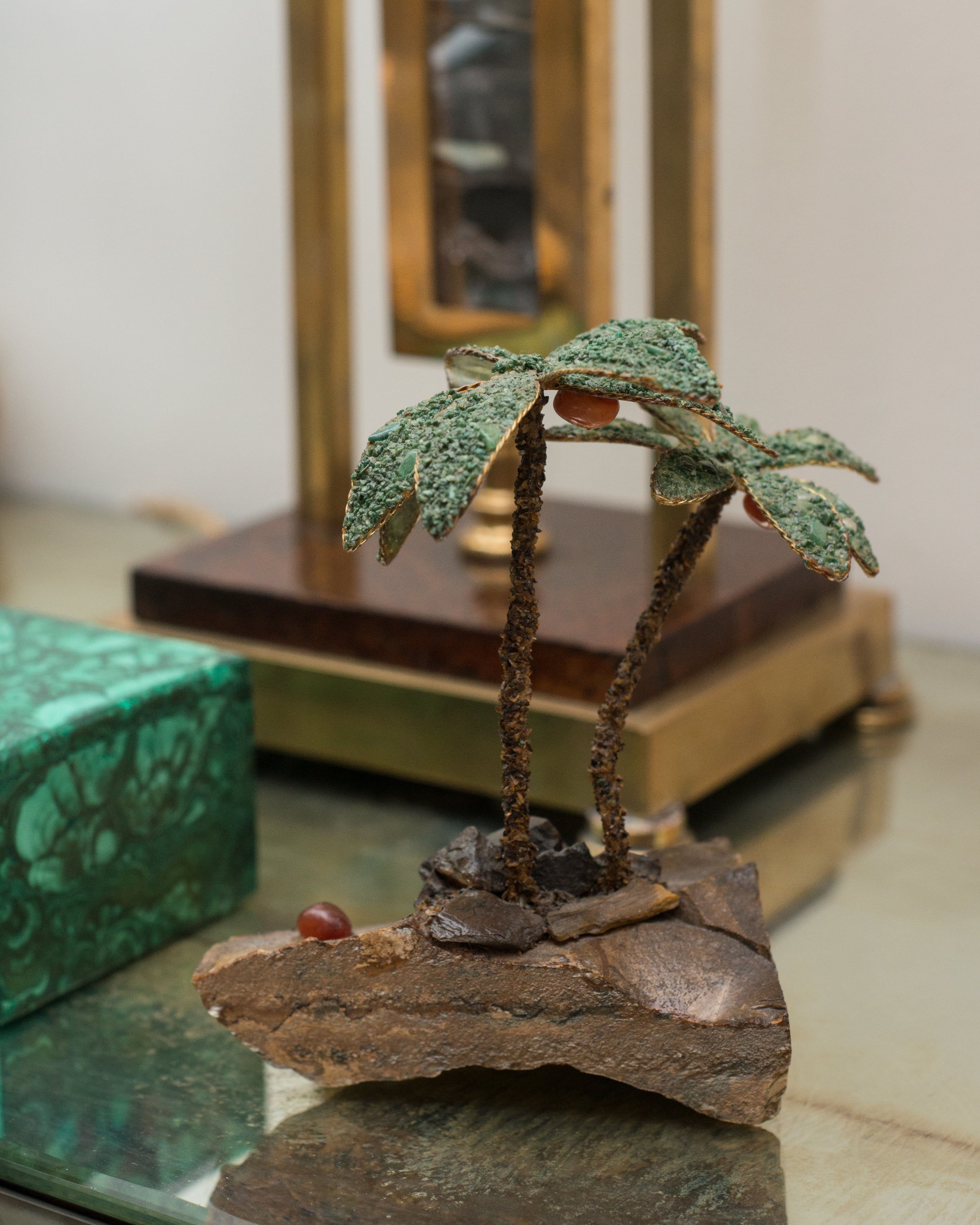 This unusual pair of semi-precious palm trees consist of Tiger's Eye trunks and Malachite leaves. These trees can be used as bookends or can remain as decorative items. Sold as a pair.