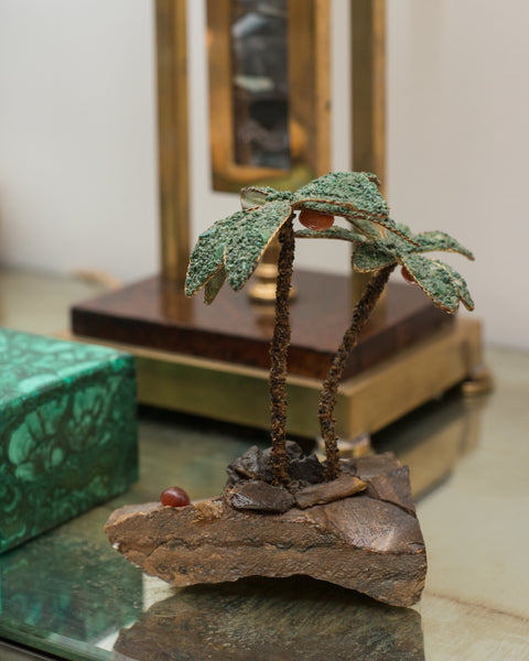 This unusual pair of semi-precious palm trees consist of Tiger's Eye trunks and Malachite leaves. These trees can be used as bookends or can remain as decorative items. Sold as a pair.