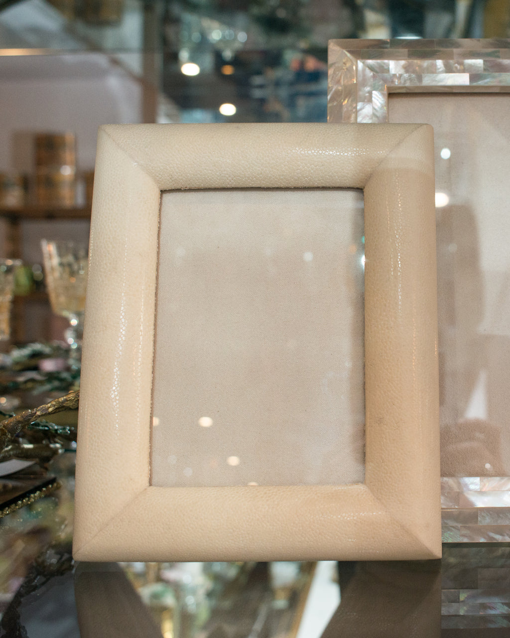 A medium picture frame in crème Shagreen & walnut,  backed in suede.