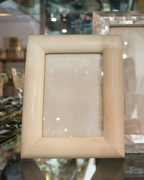 A medium picture frame in crème Shagreen & walnut,  backed in suede.