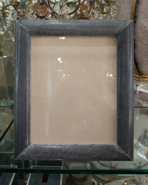 A large picture frame in blue/black Shagreen & walnut, backed in suede.