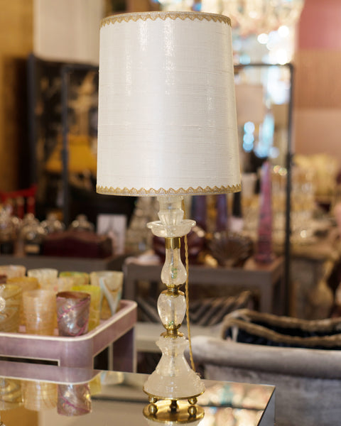 This pair of Rock Crystal and bronze lamps was sourced by Nurit in Paris. The stunning shades are hand crafted from metallic silk with vintage gold metallic trim, sourced in New York, and the interiors are silver leafed. These elegant lamps fit in a Traditional or Transitional Interior.