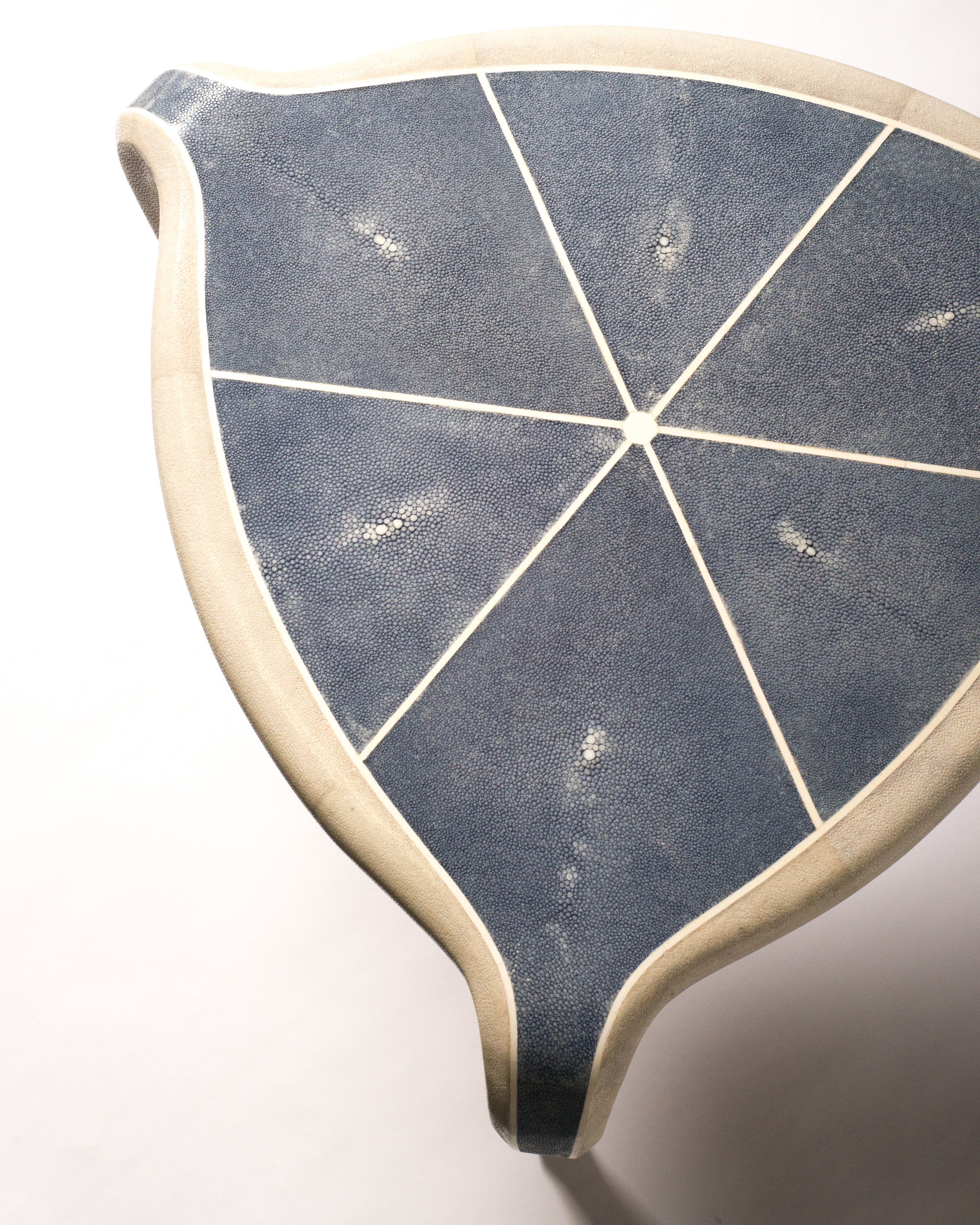 Maison Nurita is a destination for the most unusual and rare items for your home. This Tripod Table is crafted of a sycamore wood frame and completely covered in  navy blue and pale grey Shagreen and inlaid with bone. Our tables are custom designed. Instead of traditional neutrals, Maison Nurita offers Shagreen furniture in a palette of unique colours.