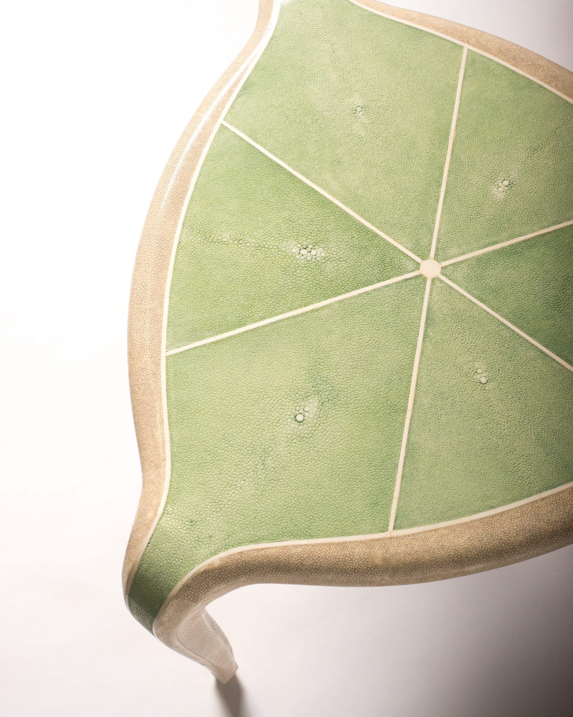 Maison Nurita is a destination for the most unusual and rare items for your home. This Tripod Table is crafted of a sycamore wood frame and completely covered in celadon green & crème Shagreen and inlaid with bone. Our tables are custom designed. Instead of traditional neutrals, Maison Nurita offers Shagreen furniture in a palette of unique colours.