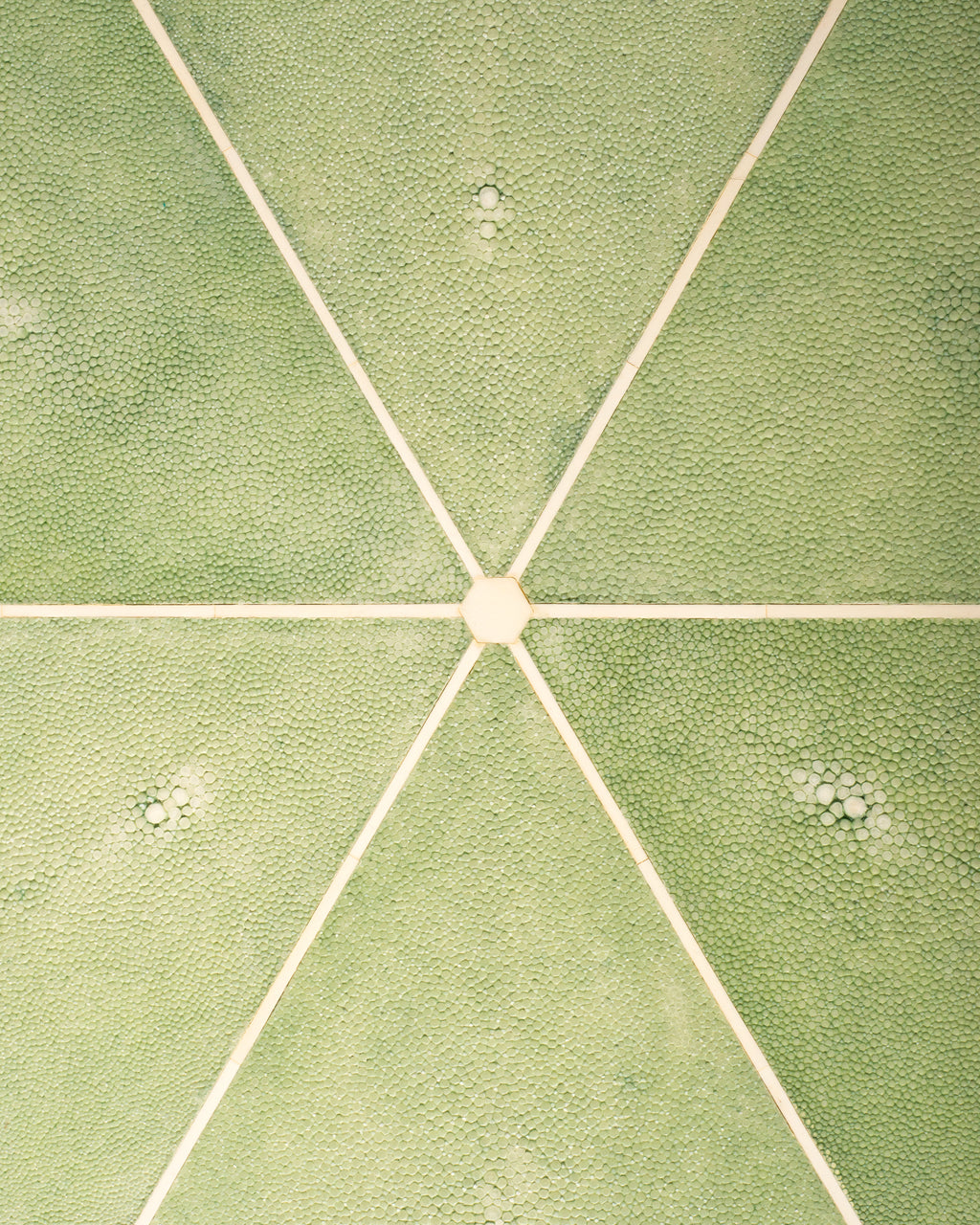Maison Nurita is a destination for the most unusual and rare items for your home. This Tripod Table is crafted of a sycamore wood frame and completely covered in celadon green & crème Shagreen and inlaid with bone. Our tables are custom designed. Instead of traditional neutrals, Maison Nurita offers Shagreen furniture in a palette of unique colours.