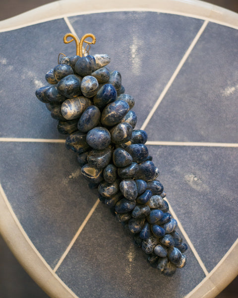 A beautiful large bunch of Sodalite grapes with a metal leaf.