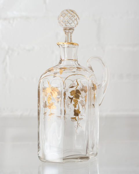 ANTIQUE GLASS AND GOLD DECANTER WITH GRAPES